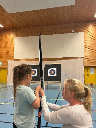 Et bilde som inneholder bueskyting, sport, person, Blink til bueskytingAutomatisk generert beskrivelse