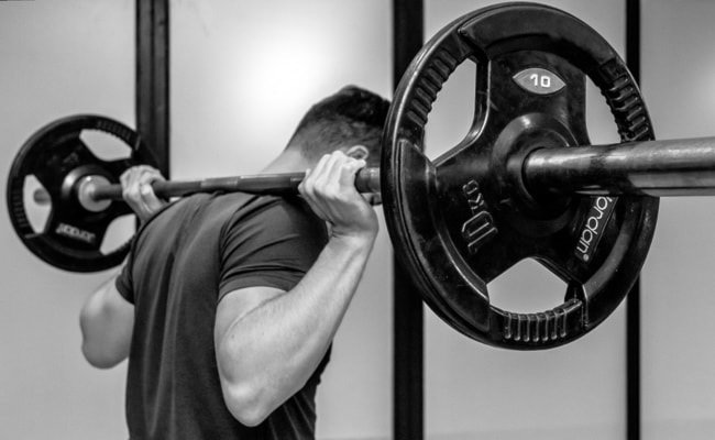 Image of a woman taking a photo.