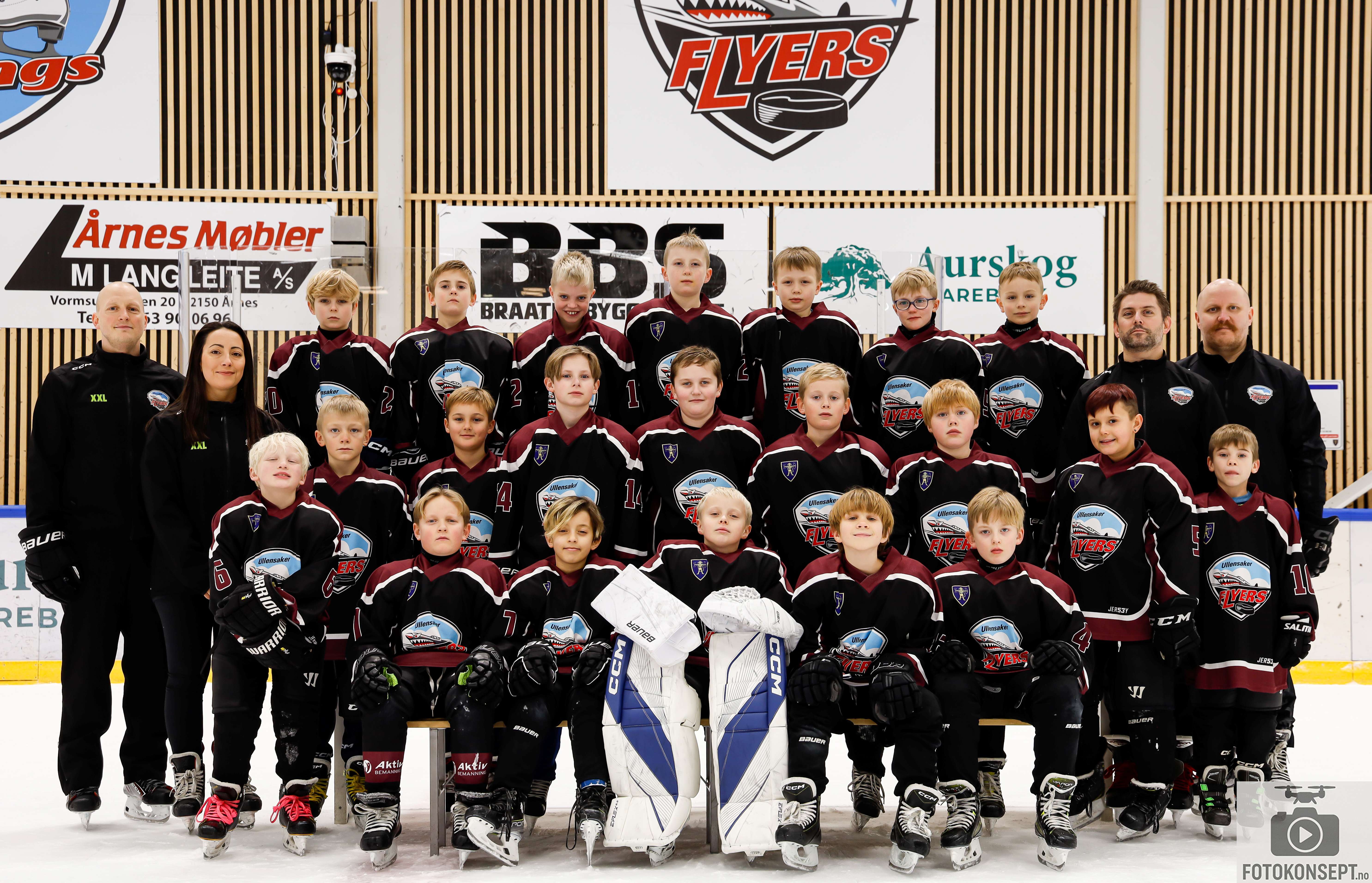 Image of a woman taking a photo.