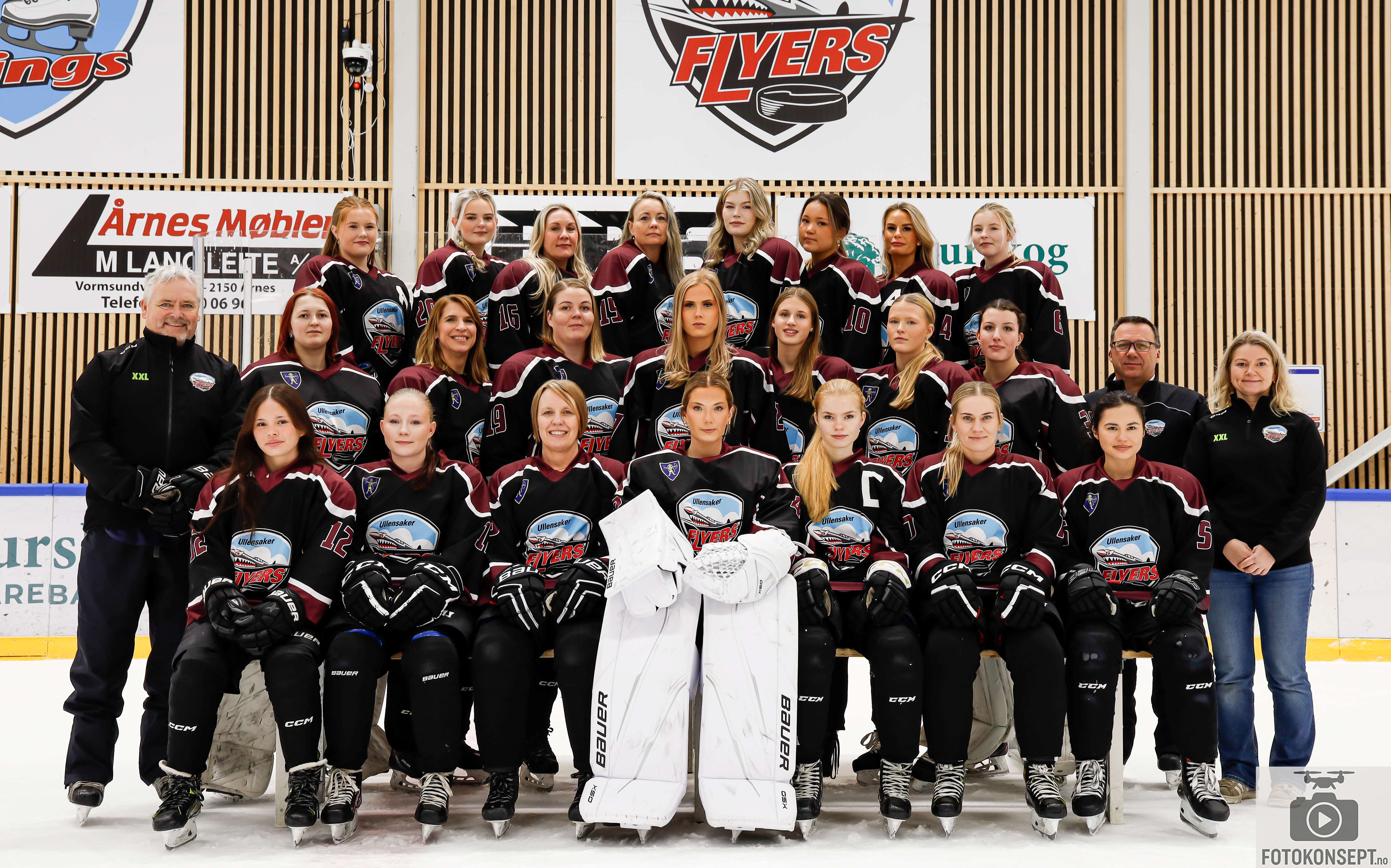 Image of a woman taking a photo.