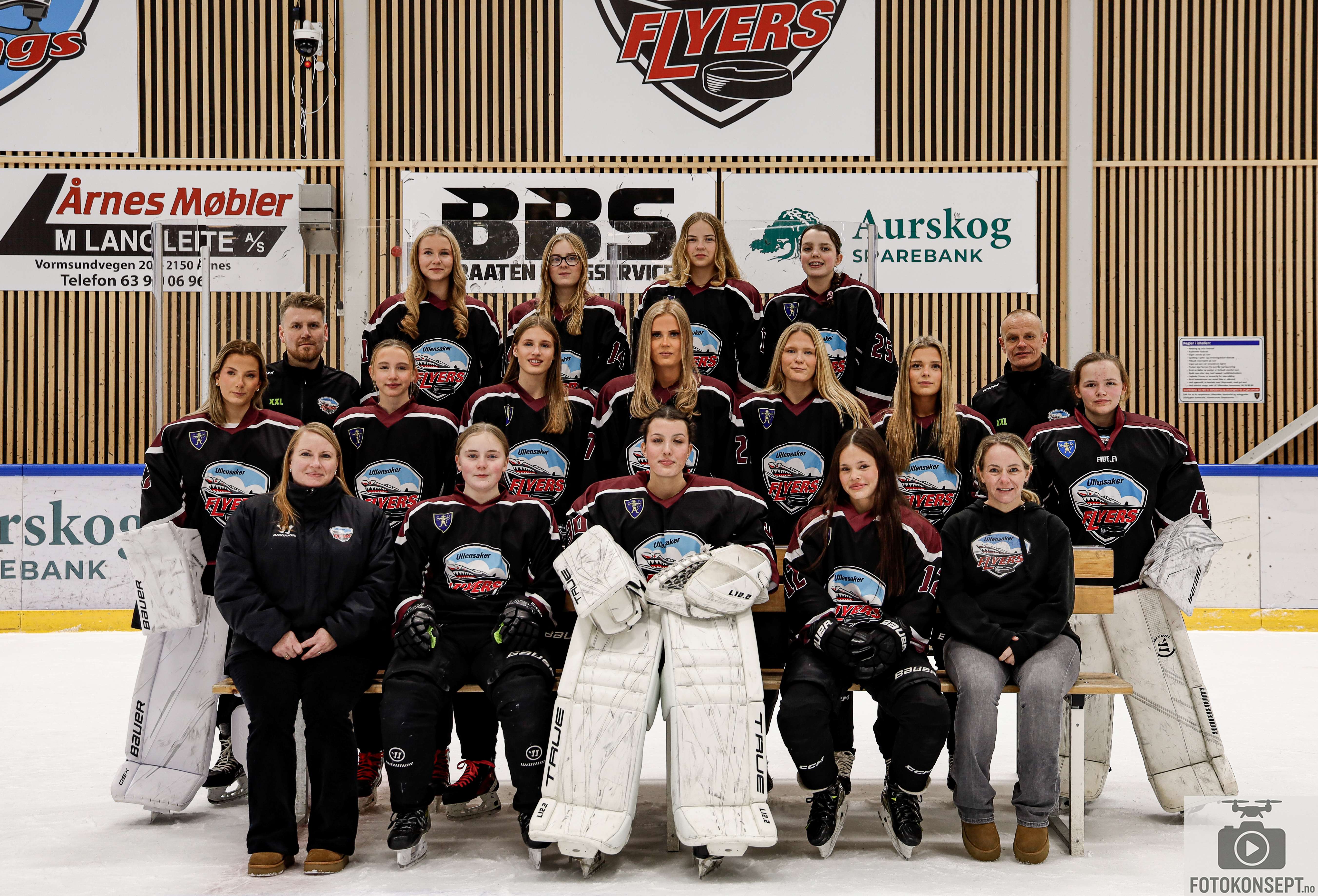 Image of a woman taking a photo.