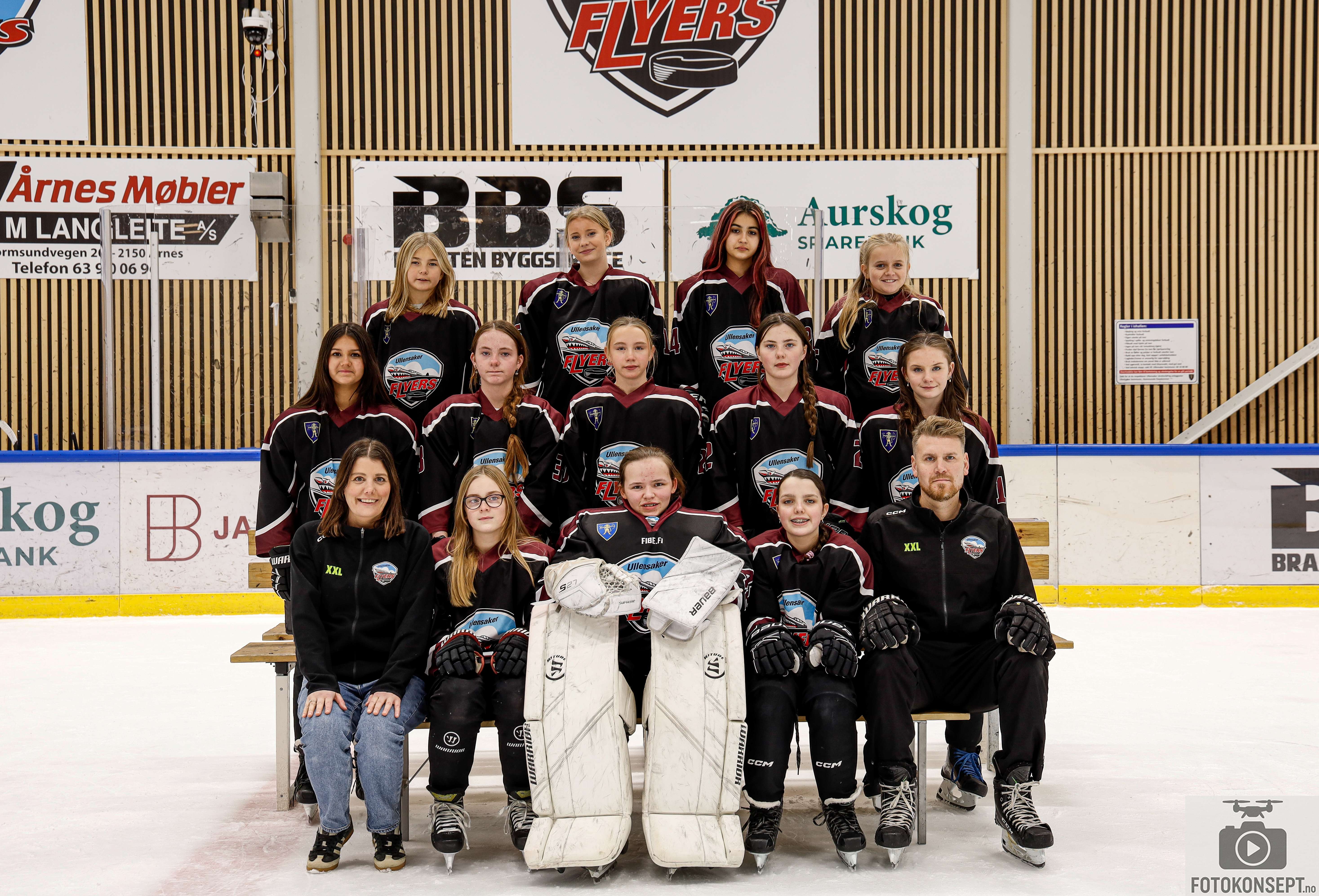 Image of a woman taking a photo.