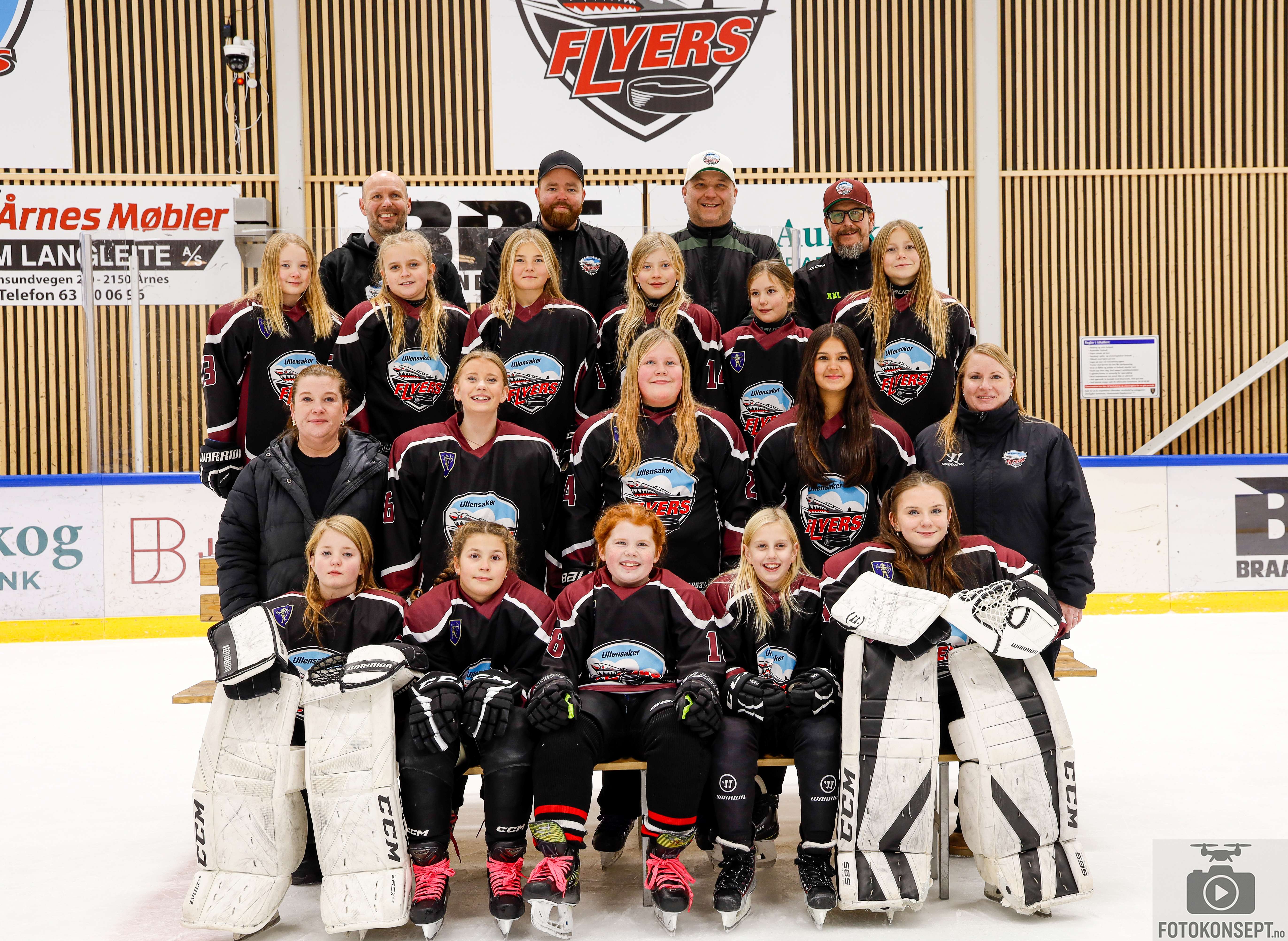 Image of a woman taking a photo.