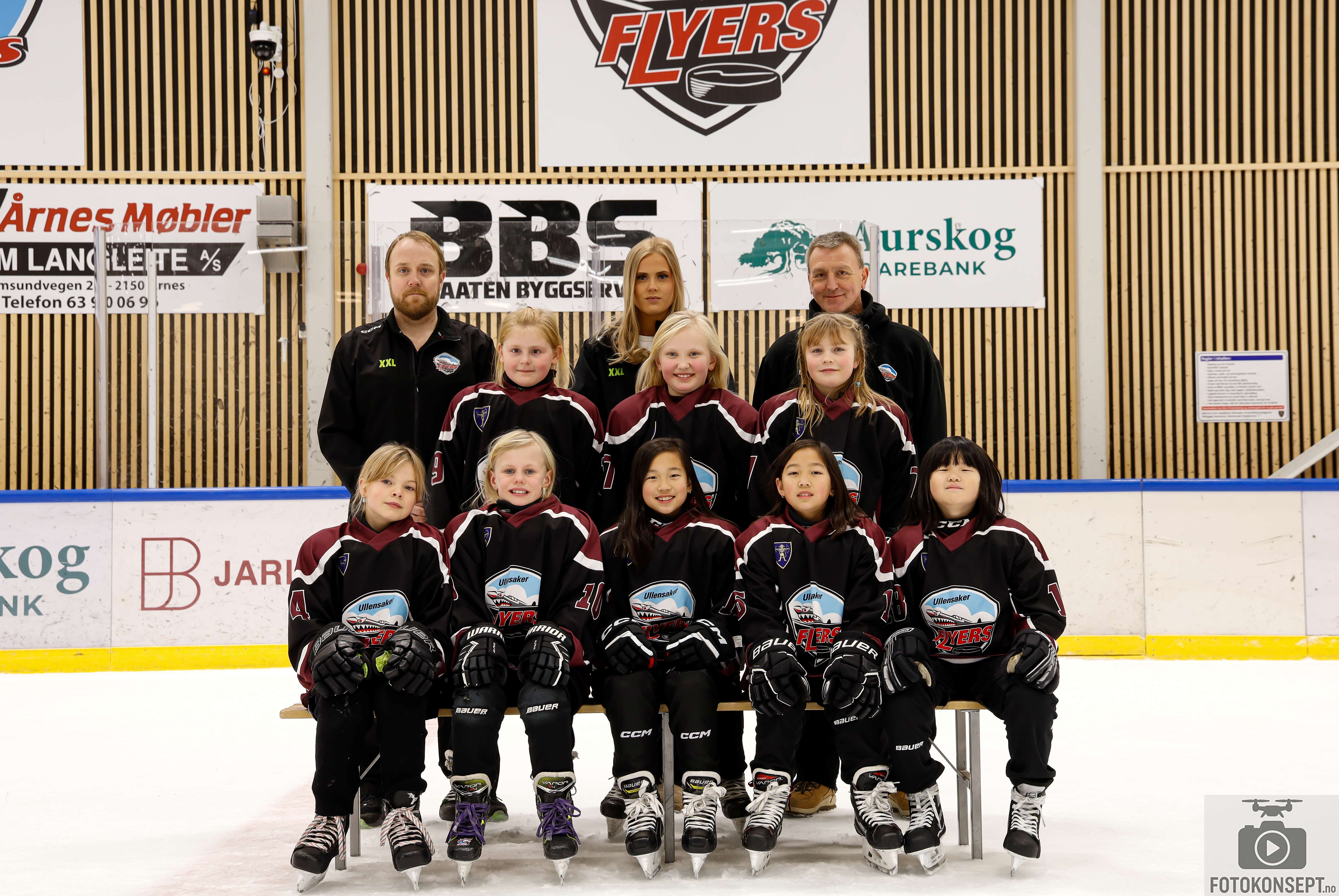 Image of a woman taking a photo.