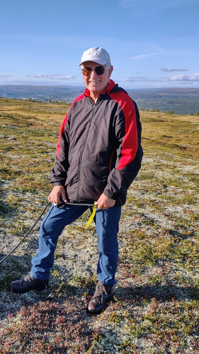 Image of a woman taking a photo.