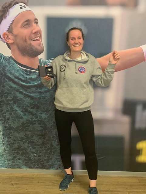 Image of a woman taking a photo.