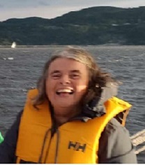 Image of a woman taking a photo.