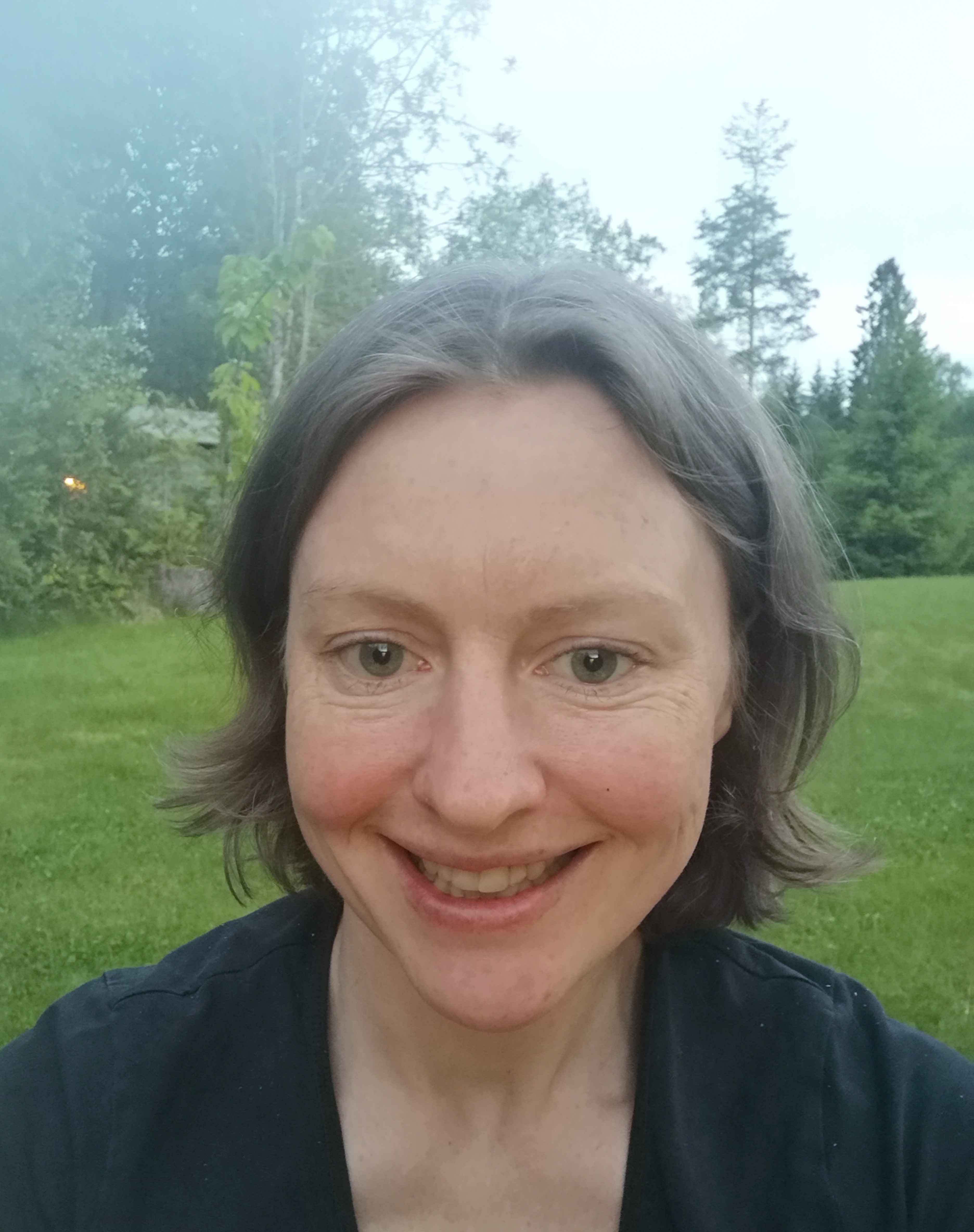 Image of a woman taking a photo.