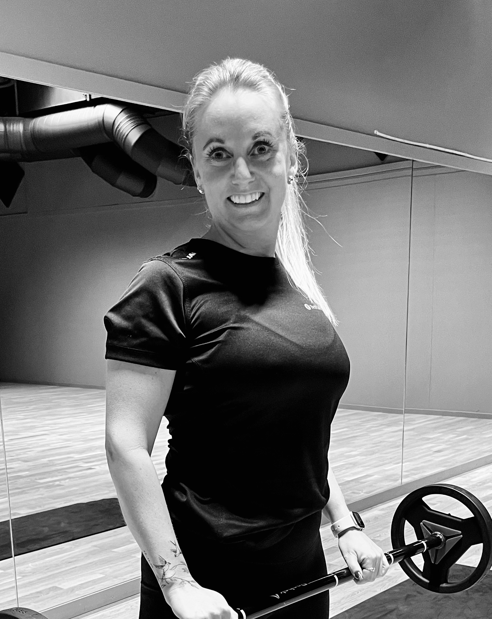 Image of a woman taking a photo.