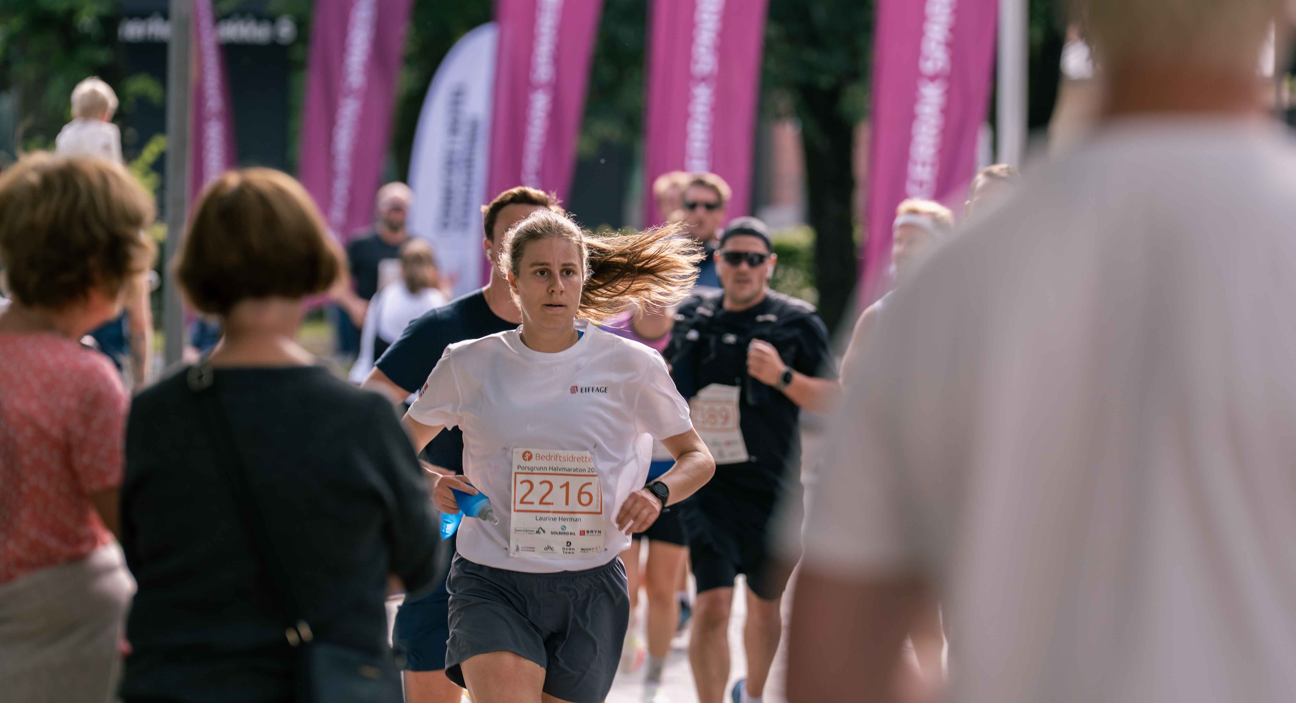 Image of a woman taking a photo.