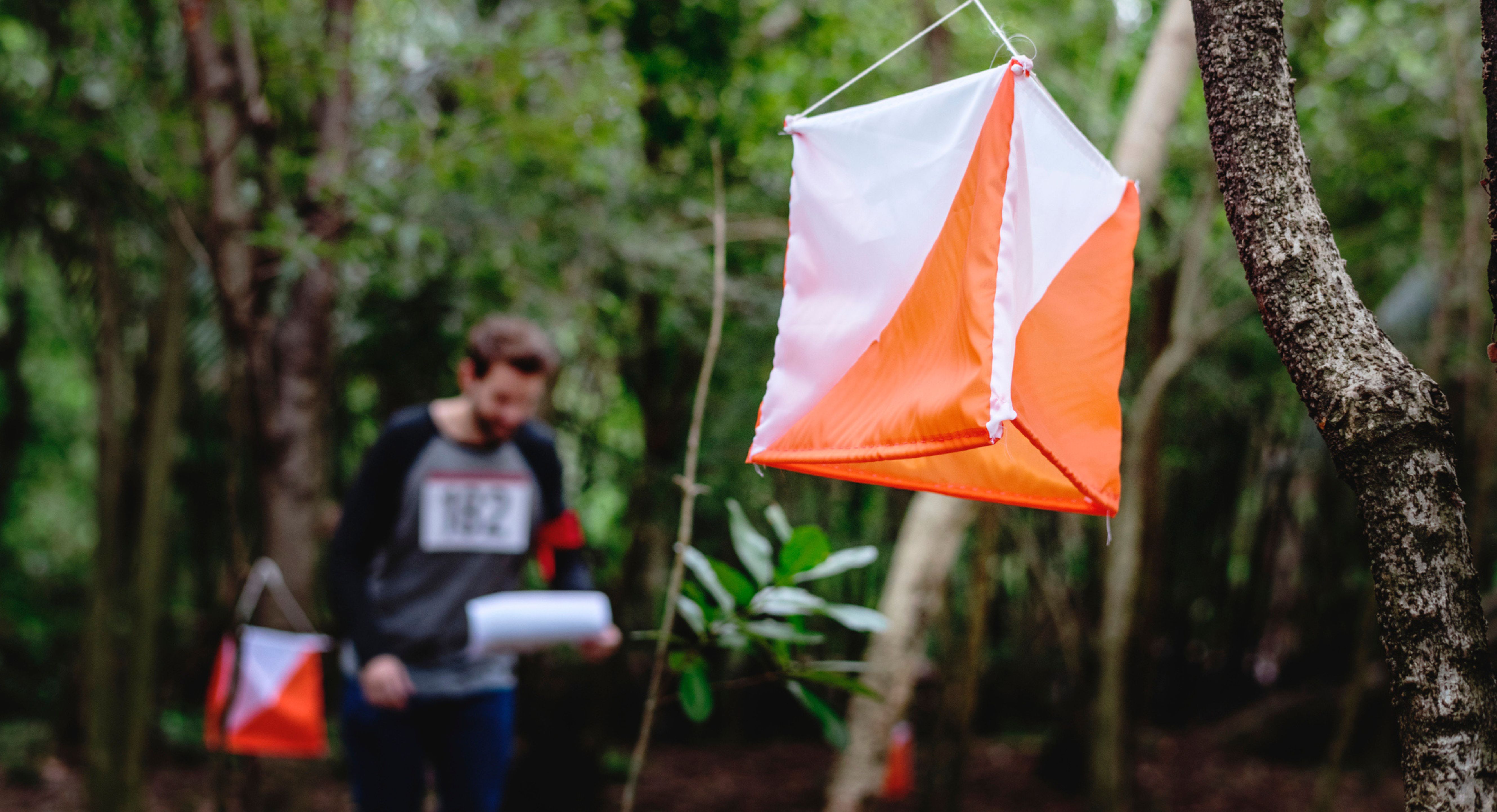 Image of a woman taking a photo.