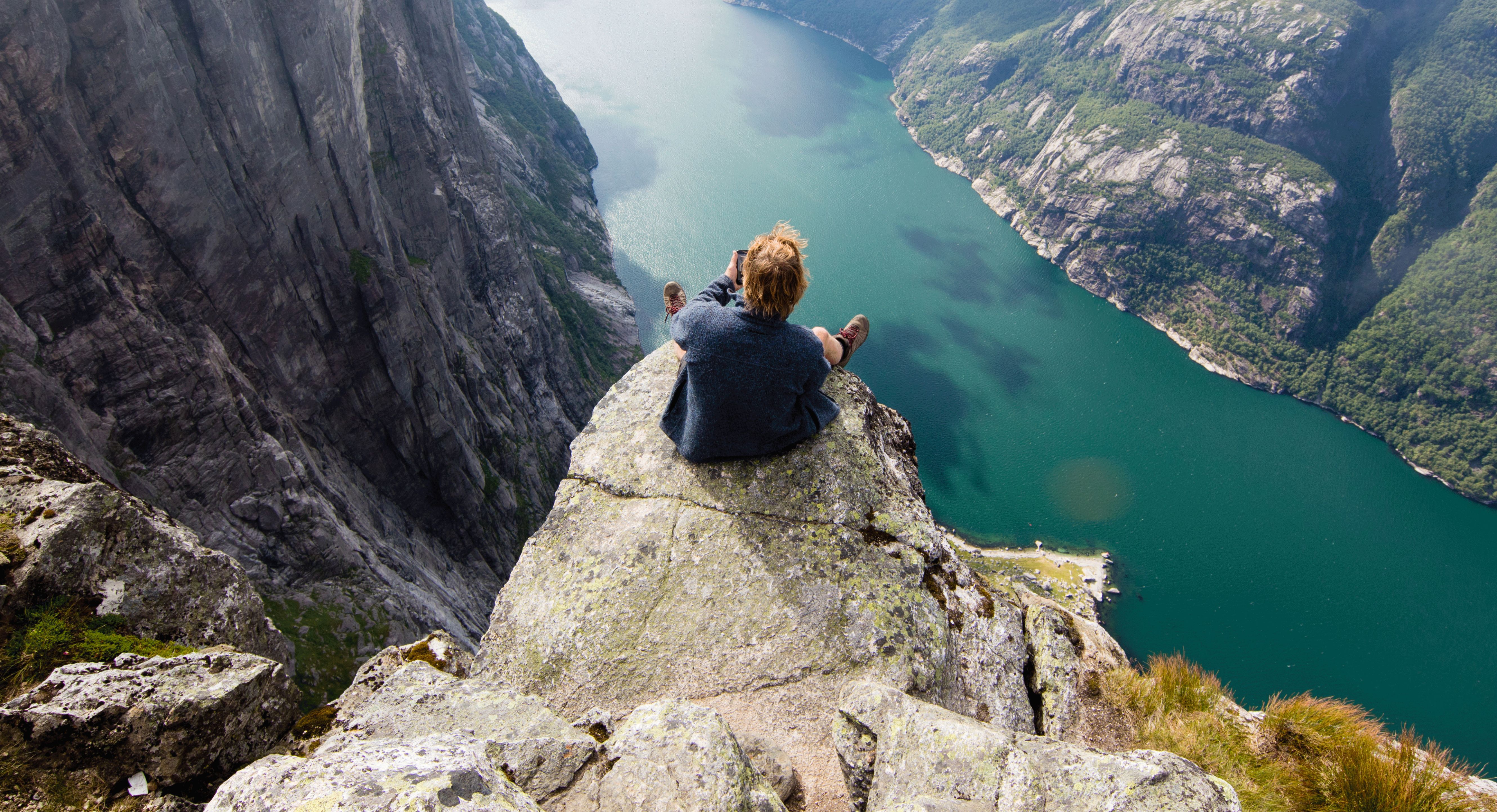 Image of a woman taking a photo.