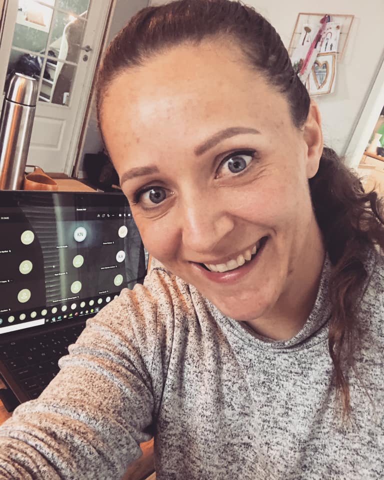 Image of a woman taking a photo.