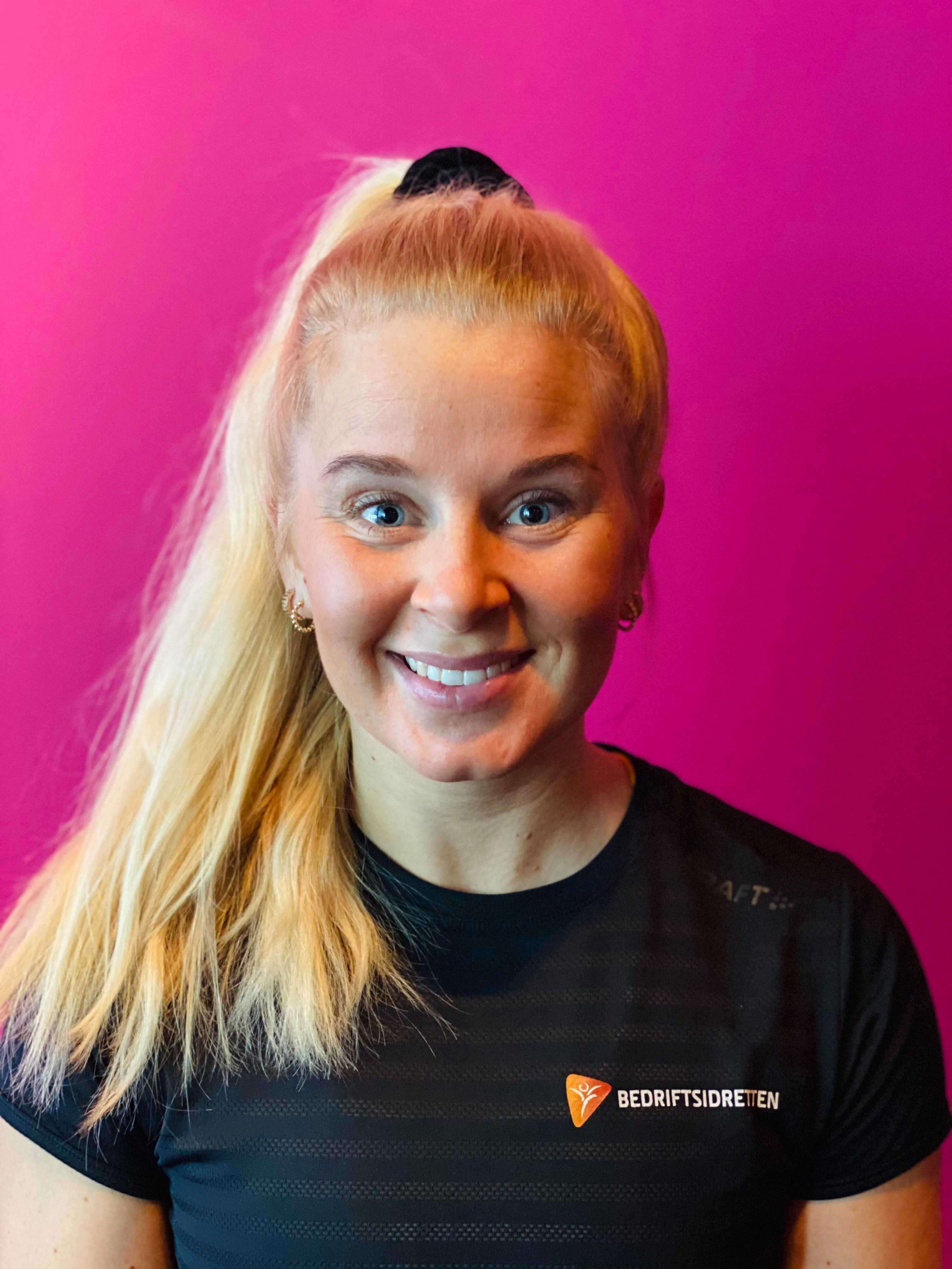 Image of a woman taking a photo.