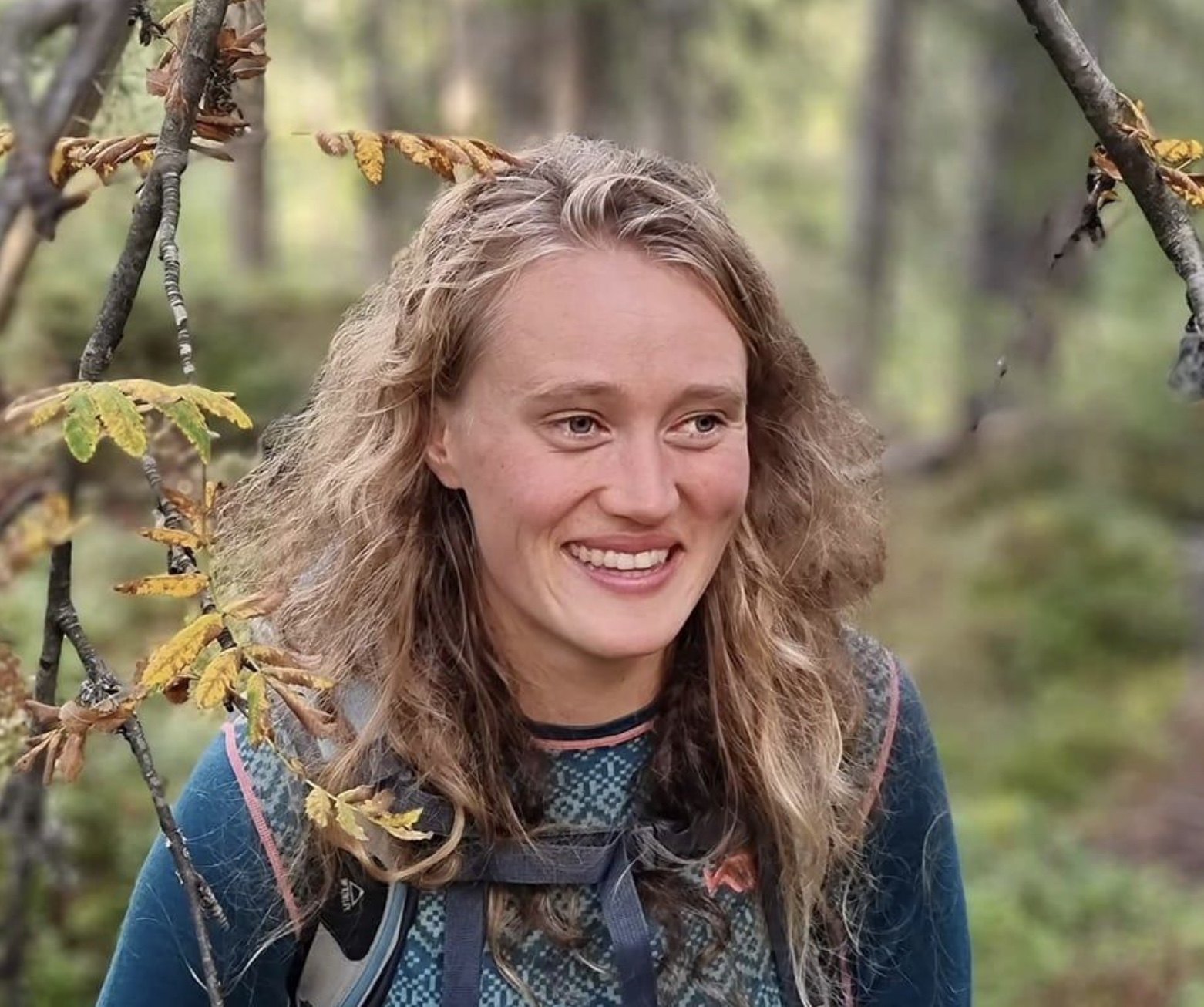 Image of a woman taking a photo.