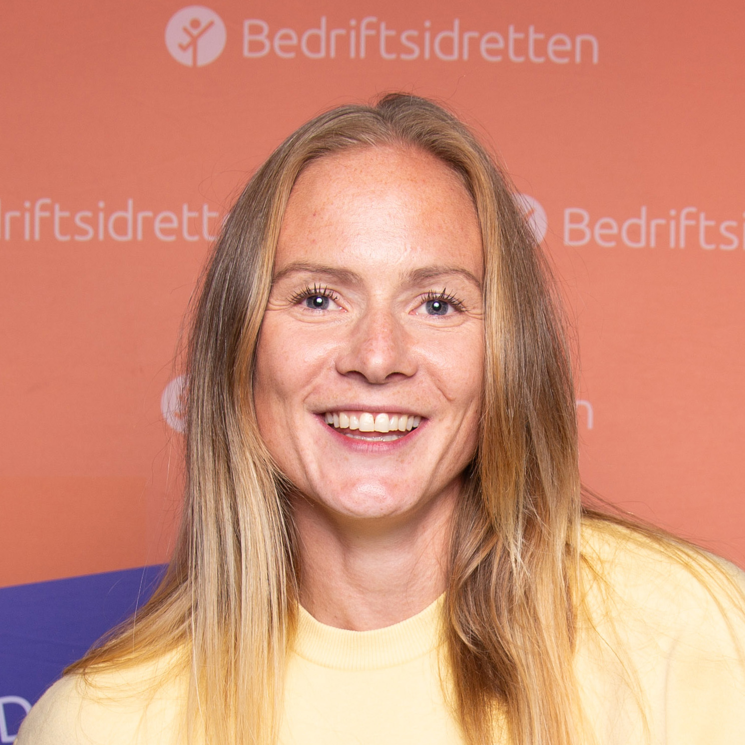 Image of a woman taking a photo.