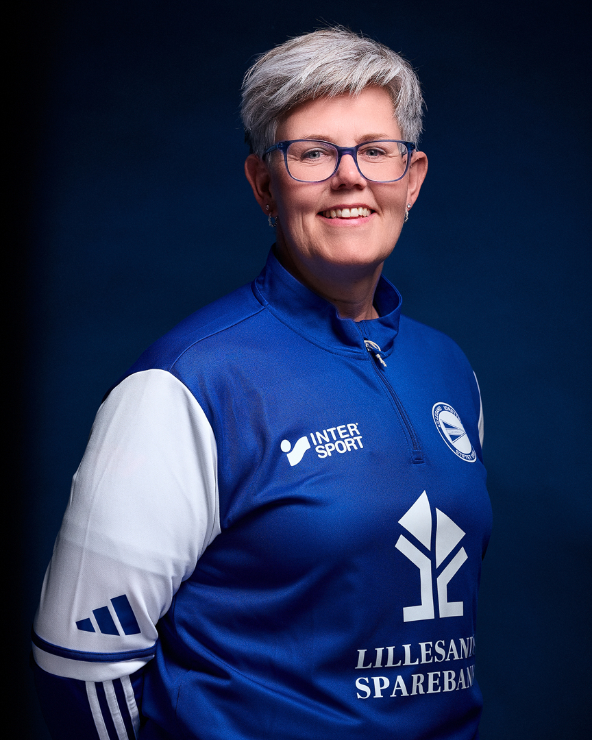 Image of a woman taking a photo.