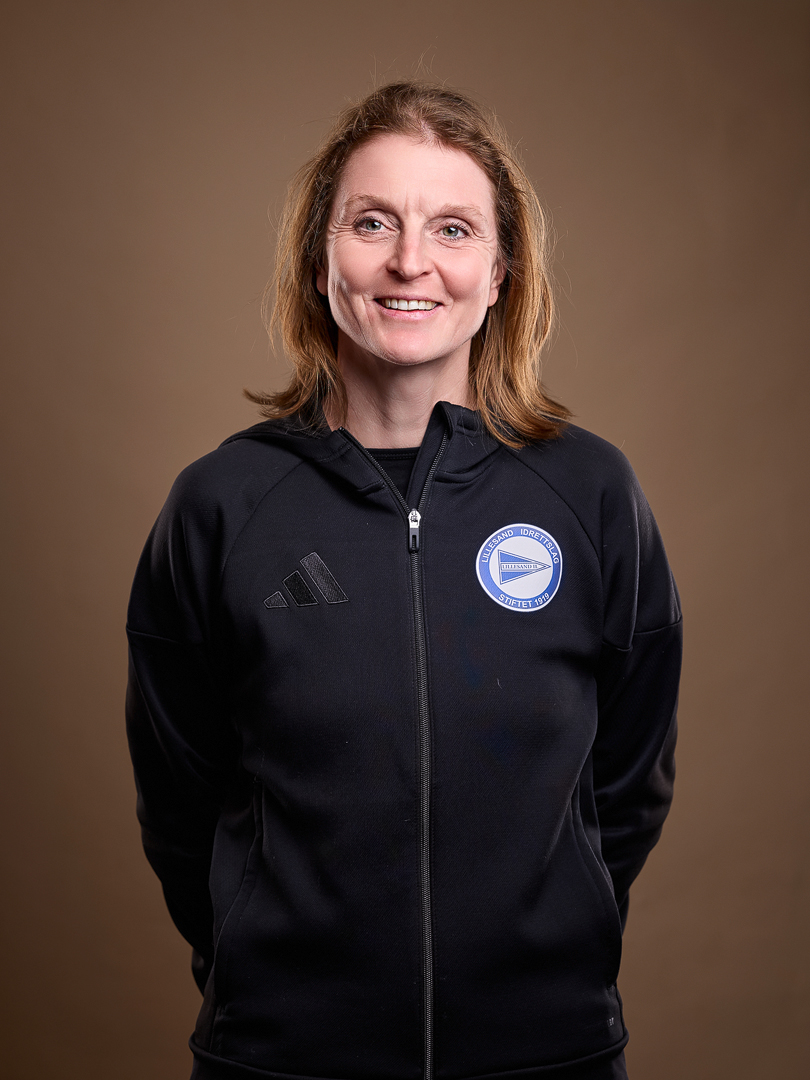 Image of a woman taking a photo.