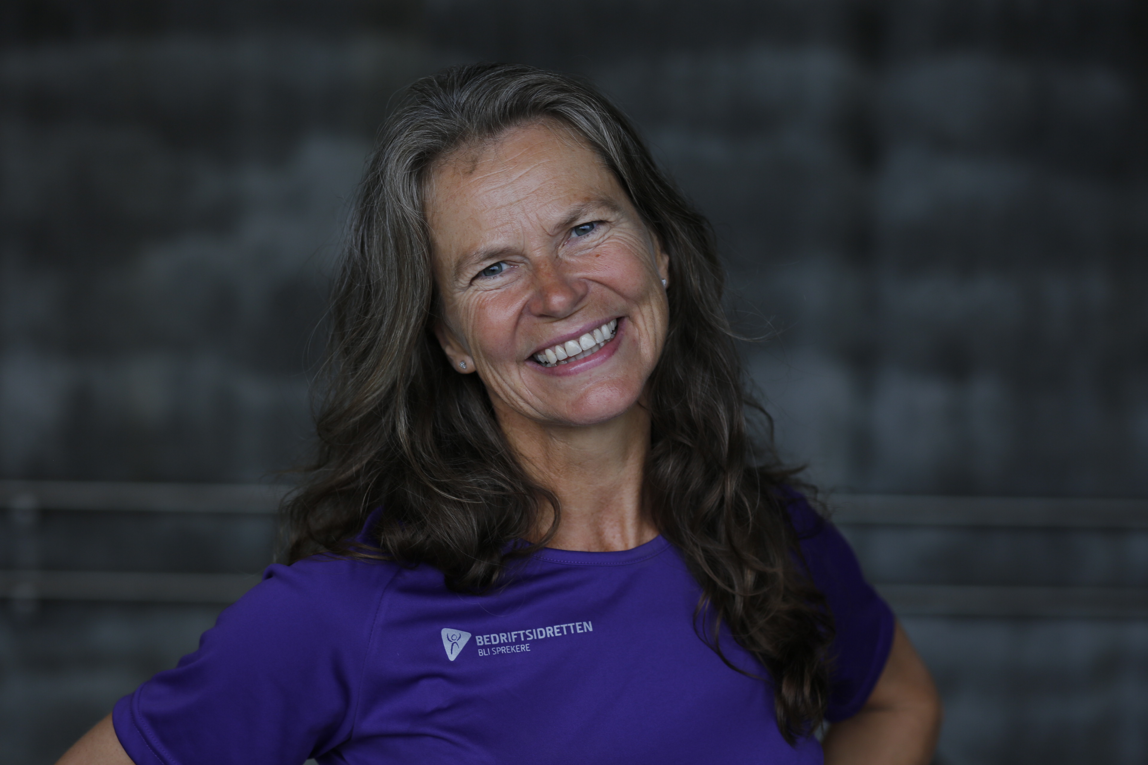 Image of a woman taking a photo.