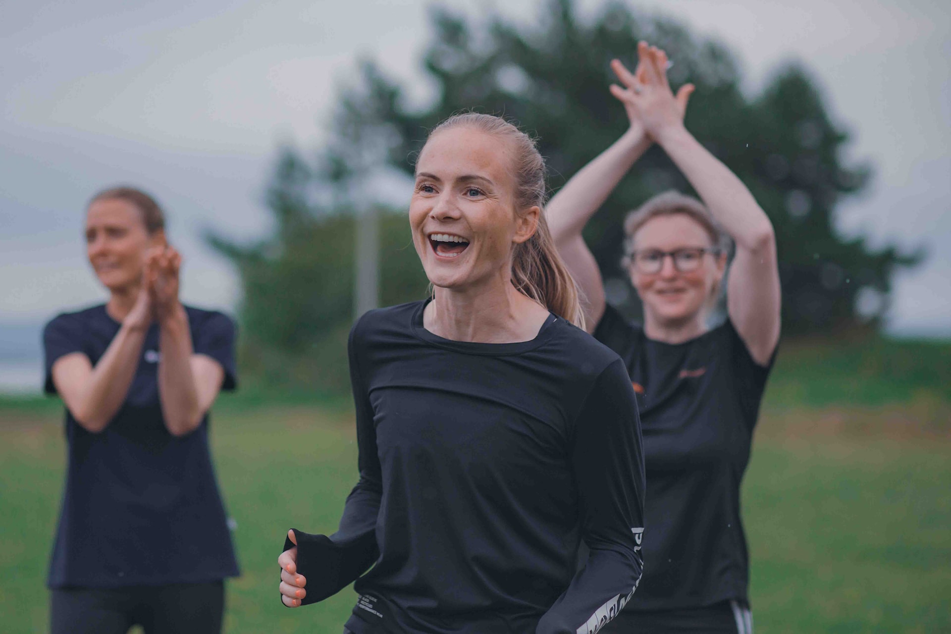 Image of a woman taking a photo.