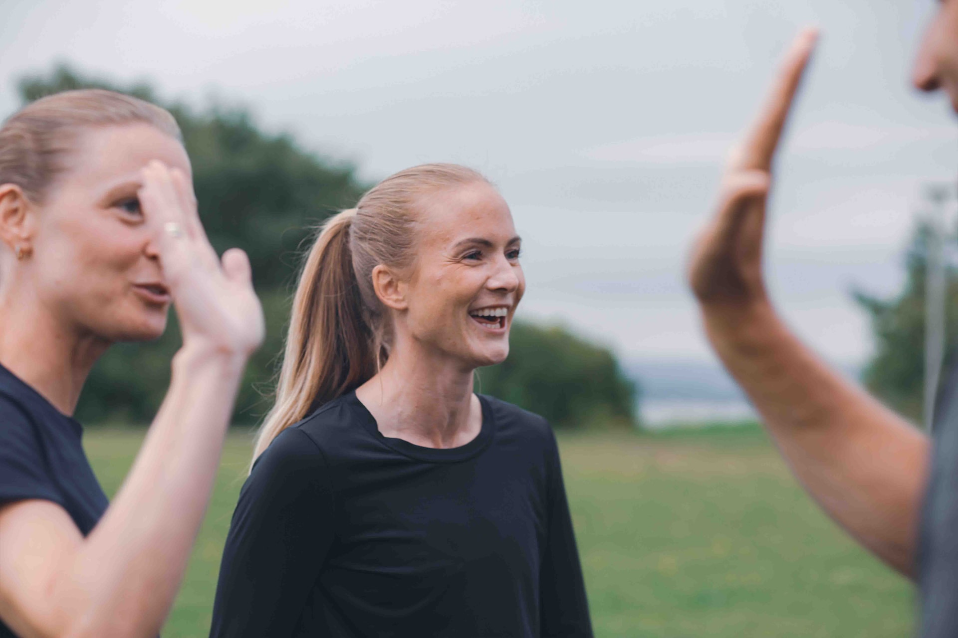 Image of a woman taking a photo.