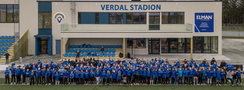 Image of a woman taking a photo.