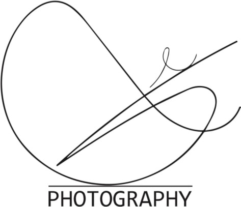 Image of a woman taking a photo.
