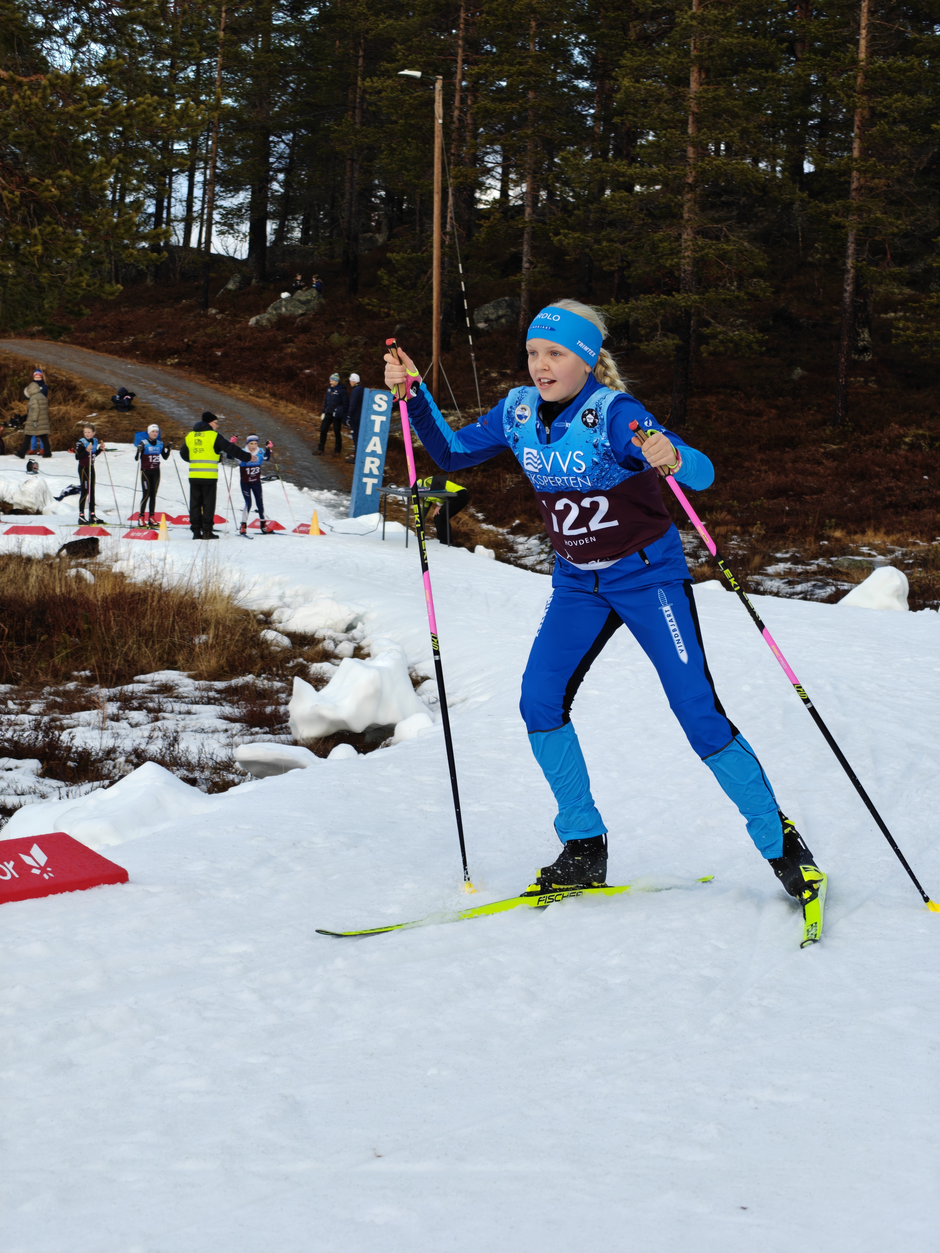 Image of a woman taking a photo.