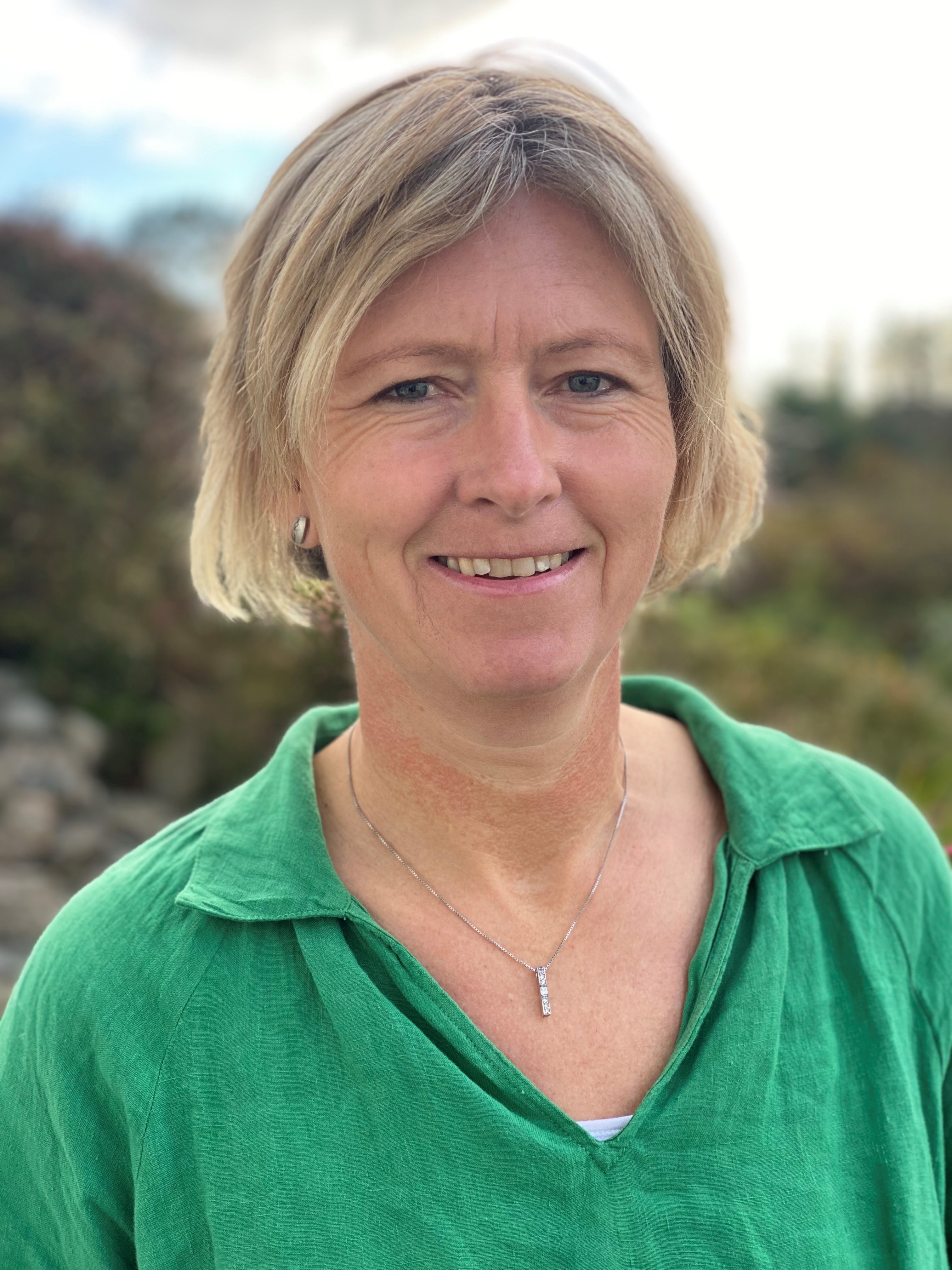 Image of a woman taking a photo.