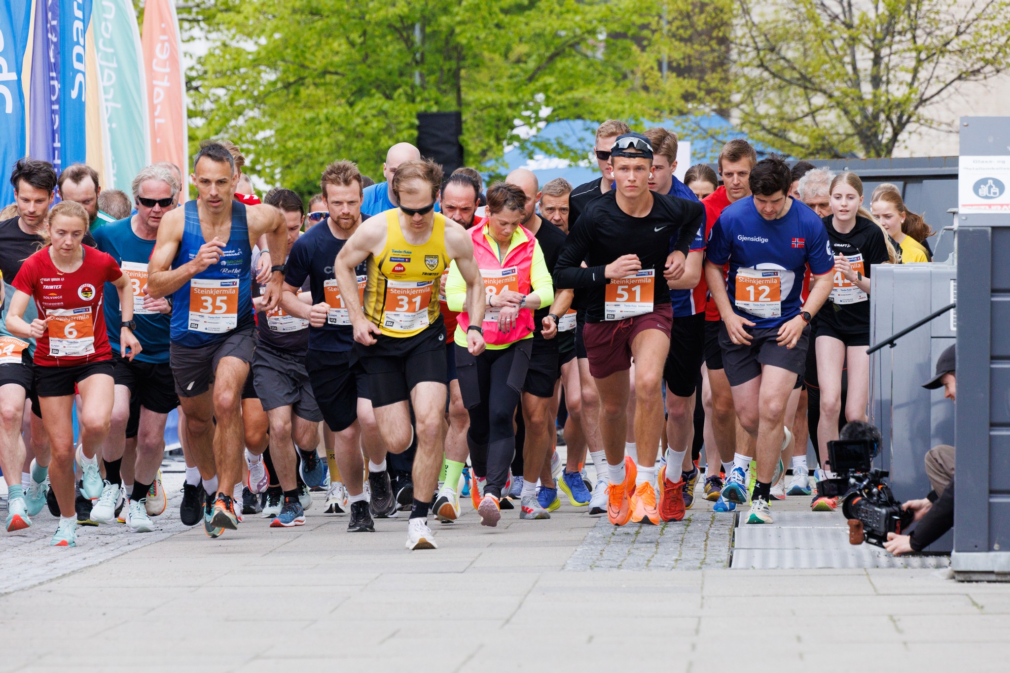Image of a woman taking a photo.