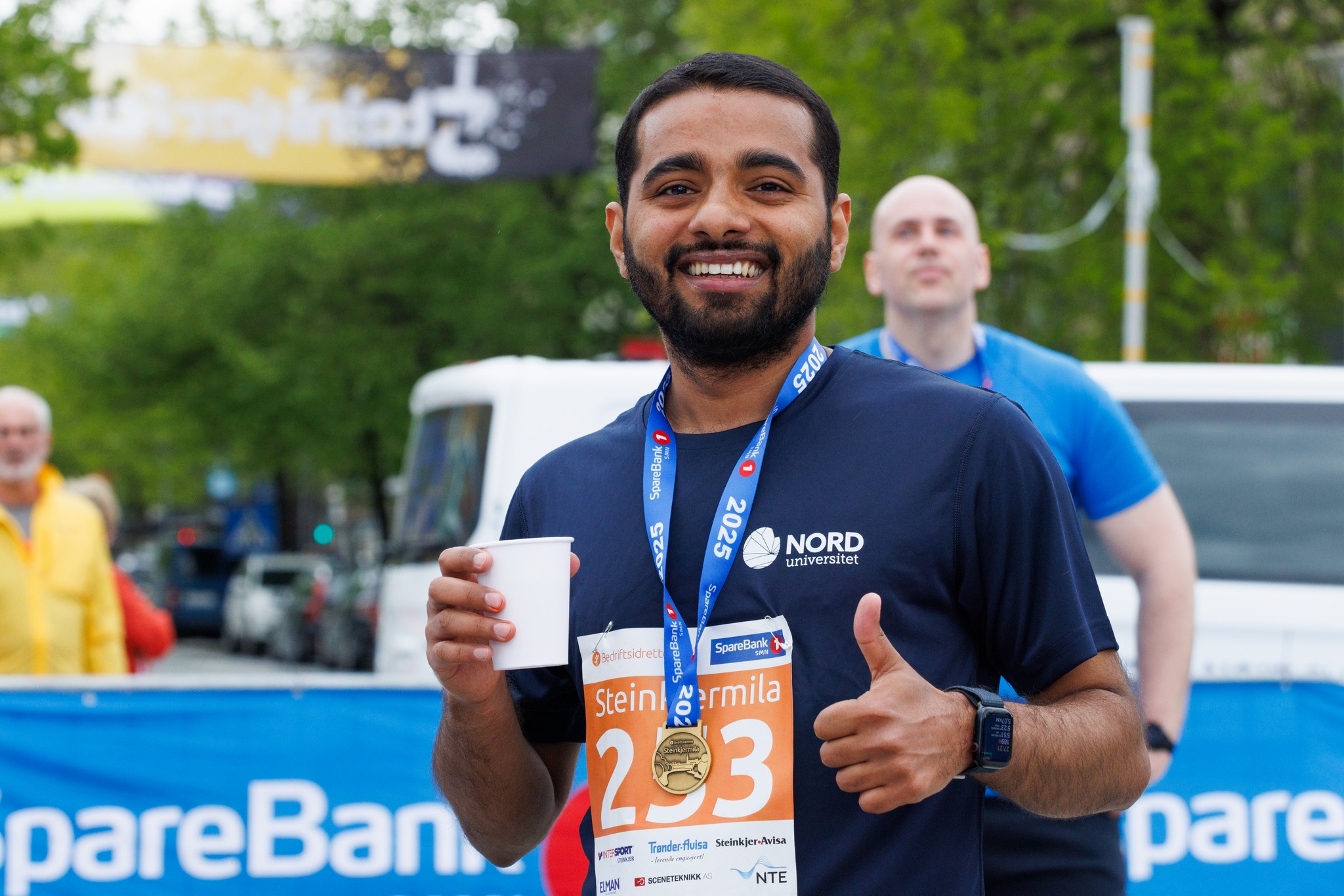 Image of a woman taking a photo.