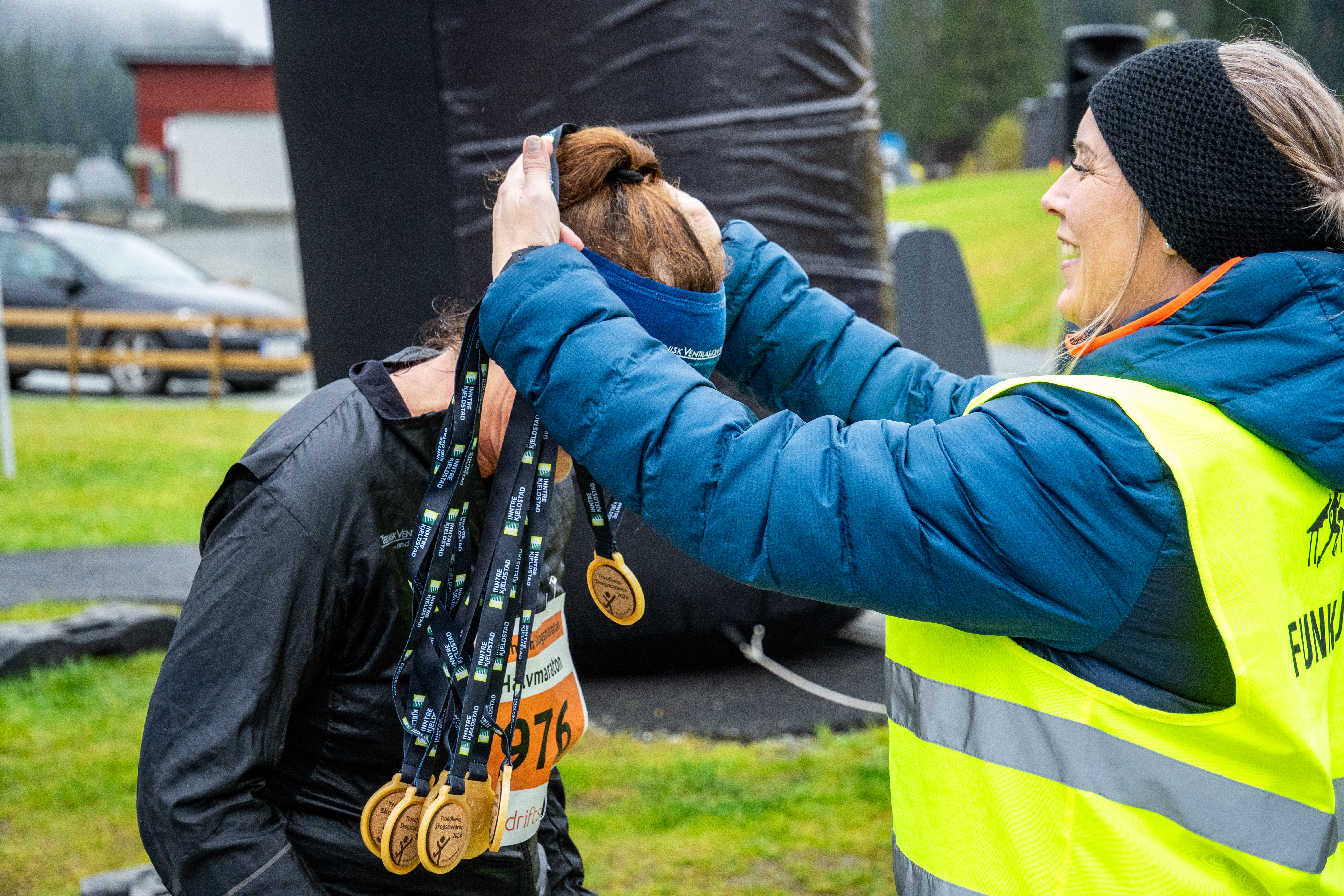 Image of a woman taking a photo.