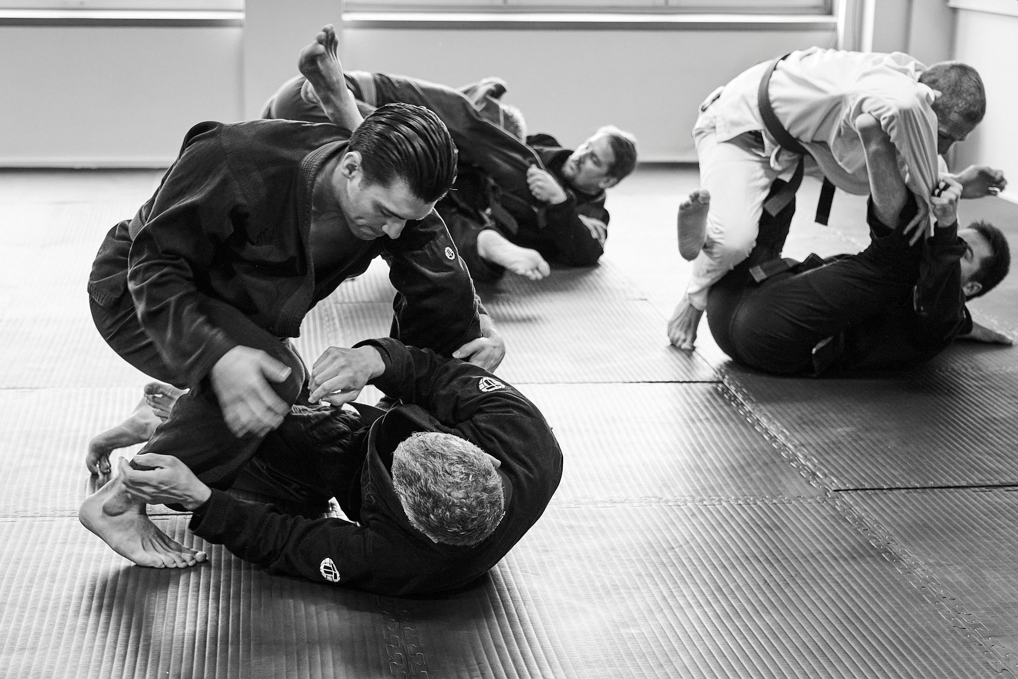 Students grappling on the mat