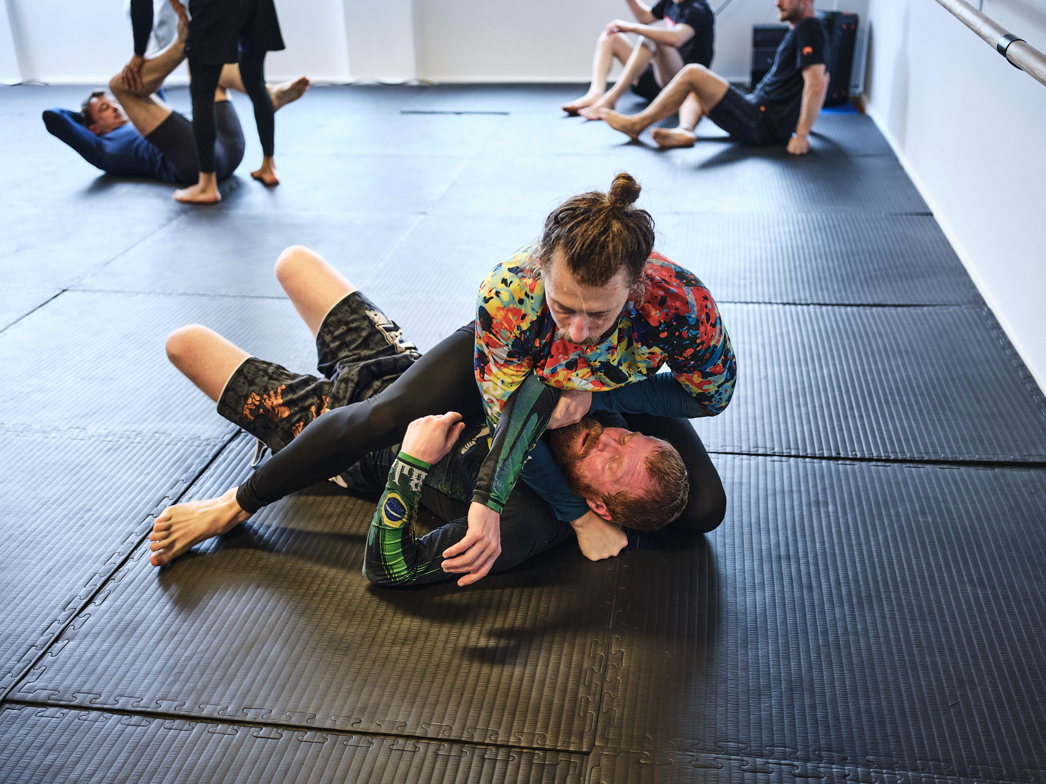 Students grappling on the mat