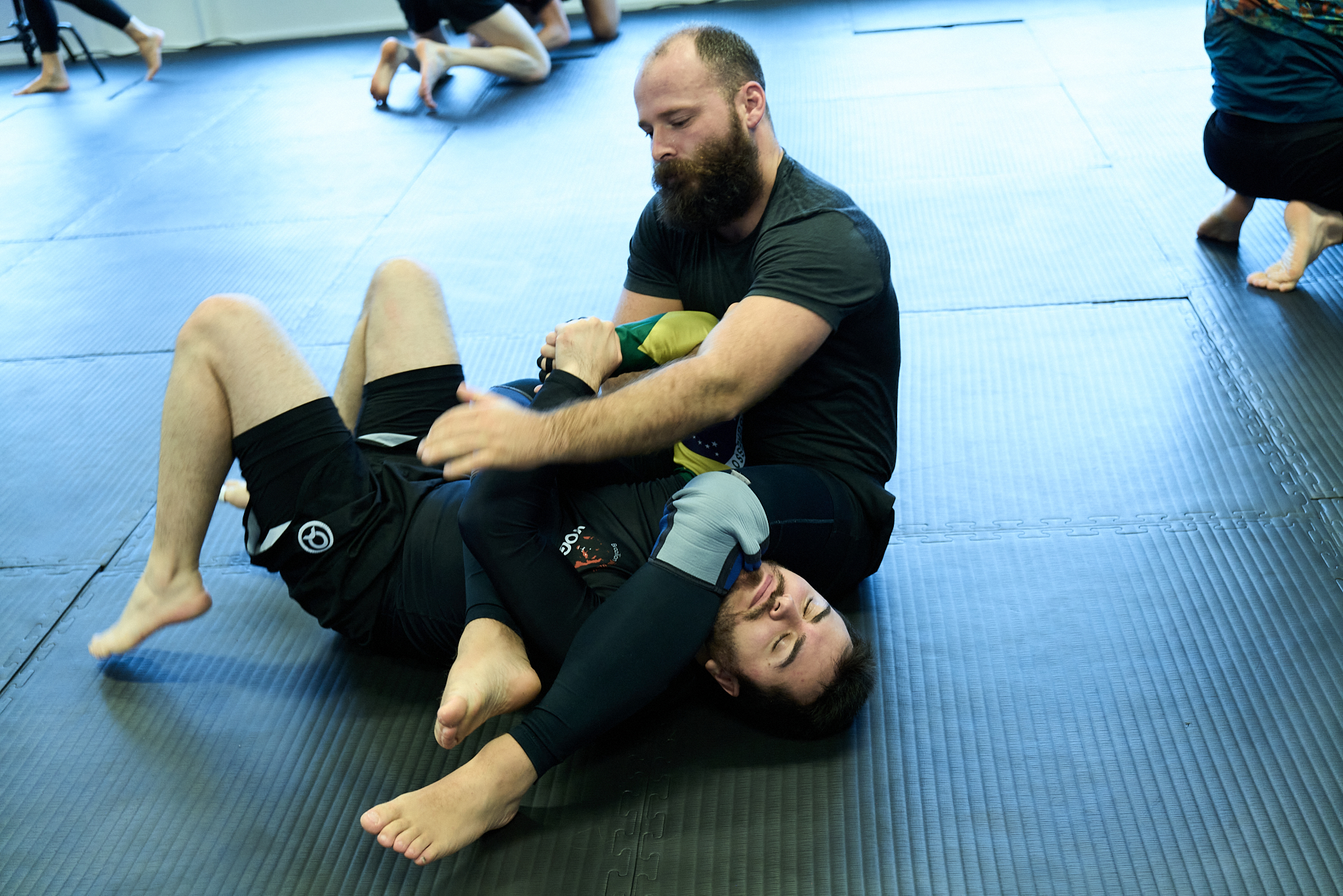 Students grappling on the mat
