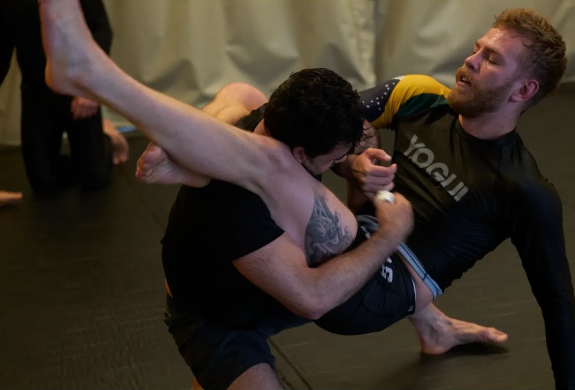 Students grappling on the mat