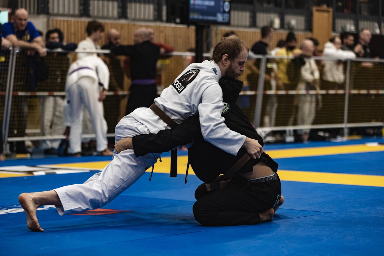 Students grappling on the mat