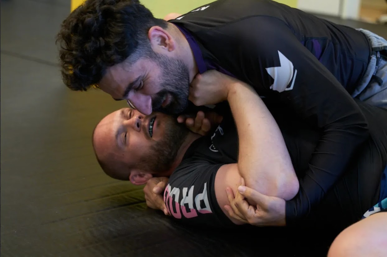 Students grappling on the mat