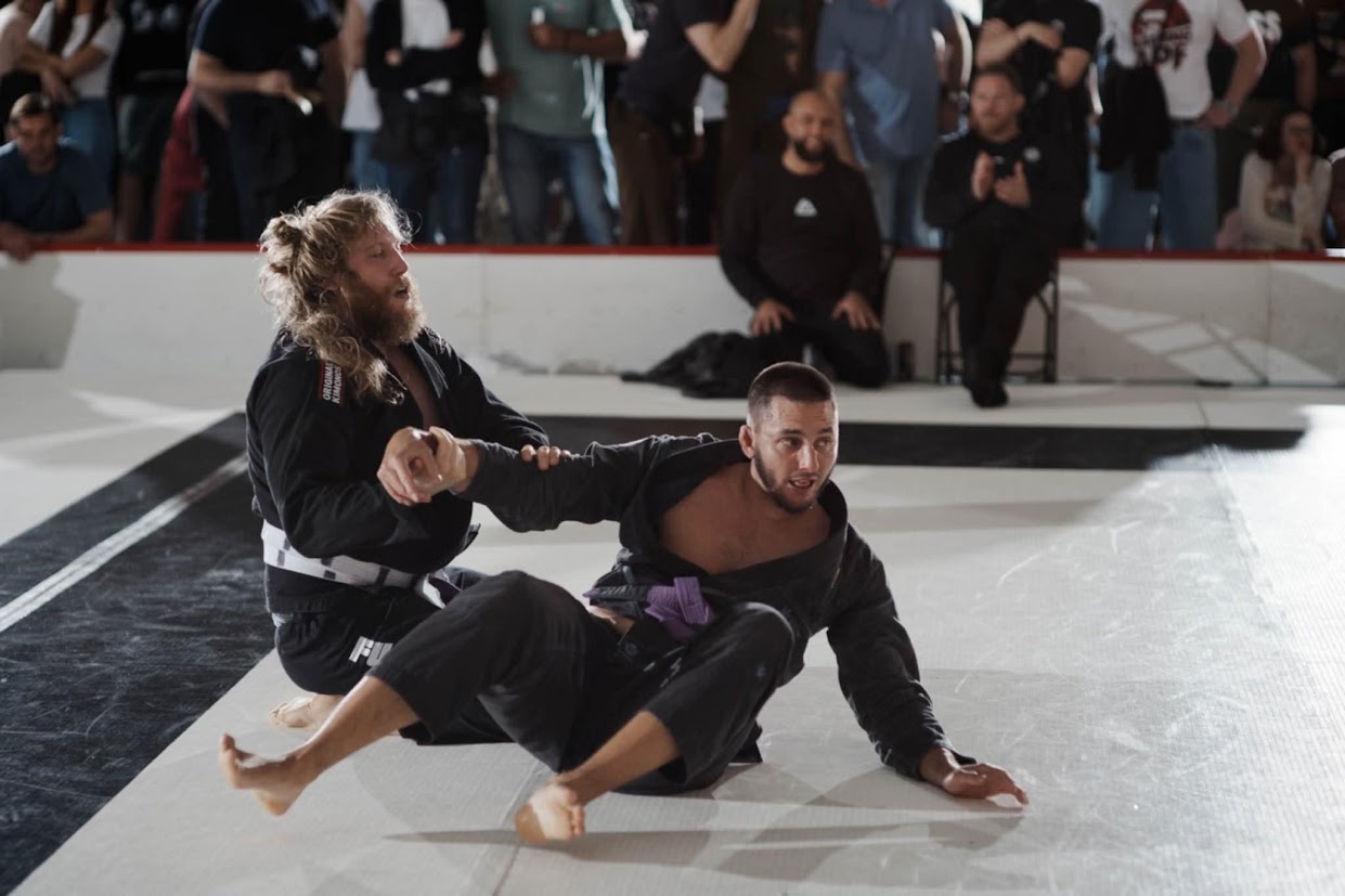 Students grappling on the mat
