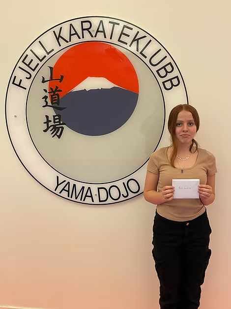 Image of a woman taking a photo.