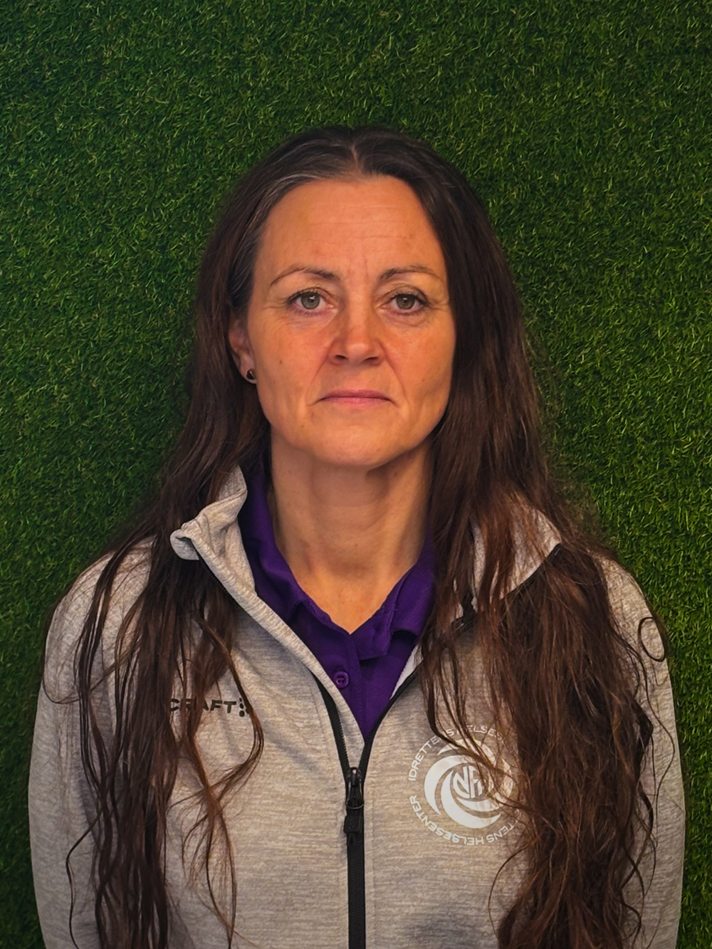 Image of a woman taking a photo.