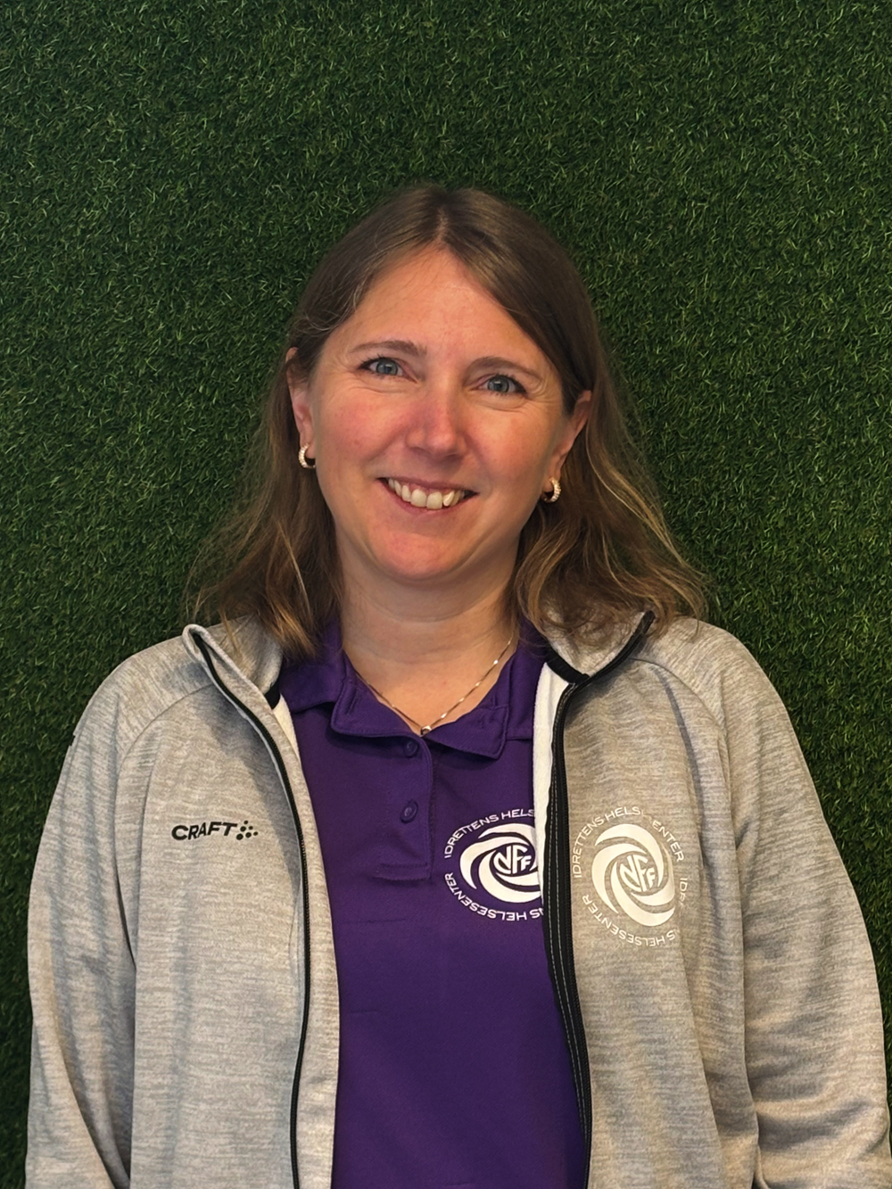 Image of a woman taking a photo.