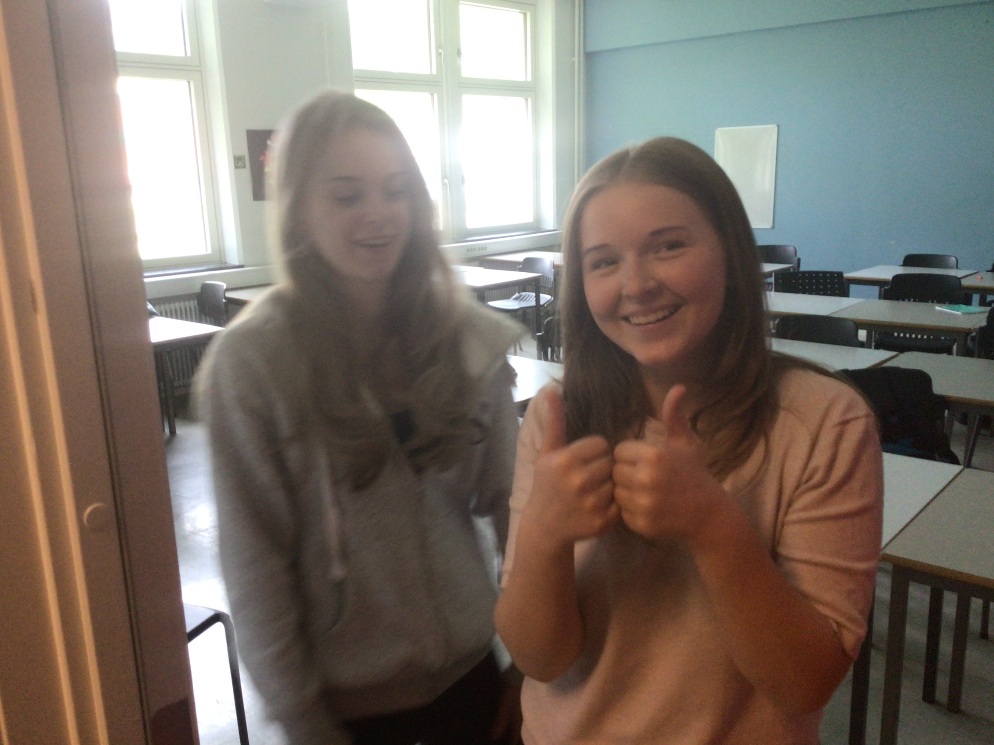 Image of a woman taking a photo.